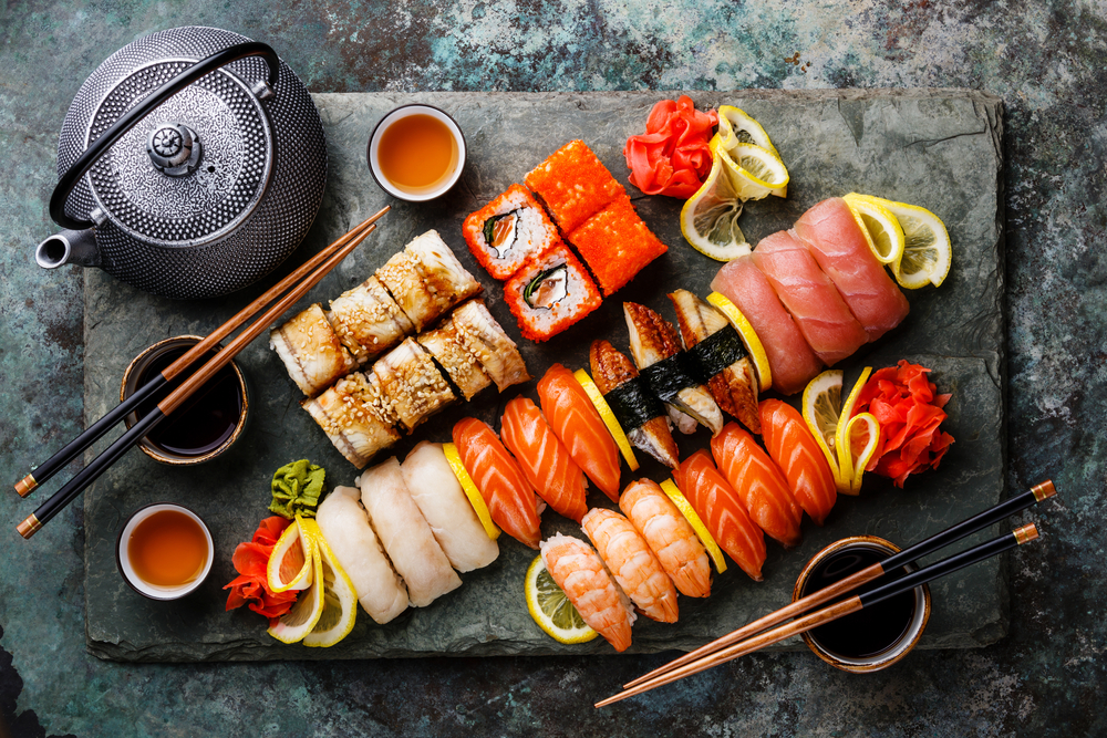 Sushi,Set,Nigiri,And,Sushi,Rolls,With,Tea,Served,On